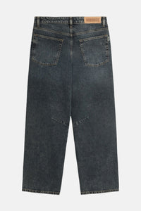 Dark grey jeans on a light gray background